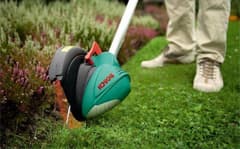 Siistit nurmikon reunat syntyvät viimeistelyleikkurilla