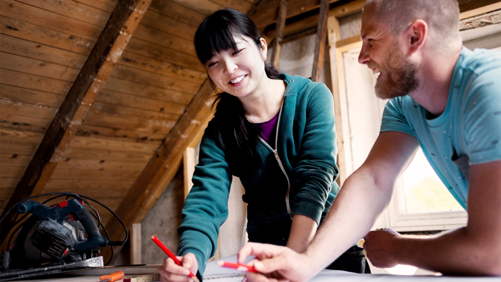 couple-making-plans-to-renovate-old-attic-2024.jpg