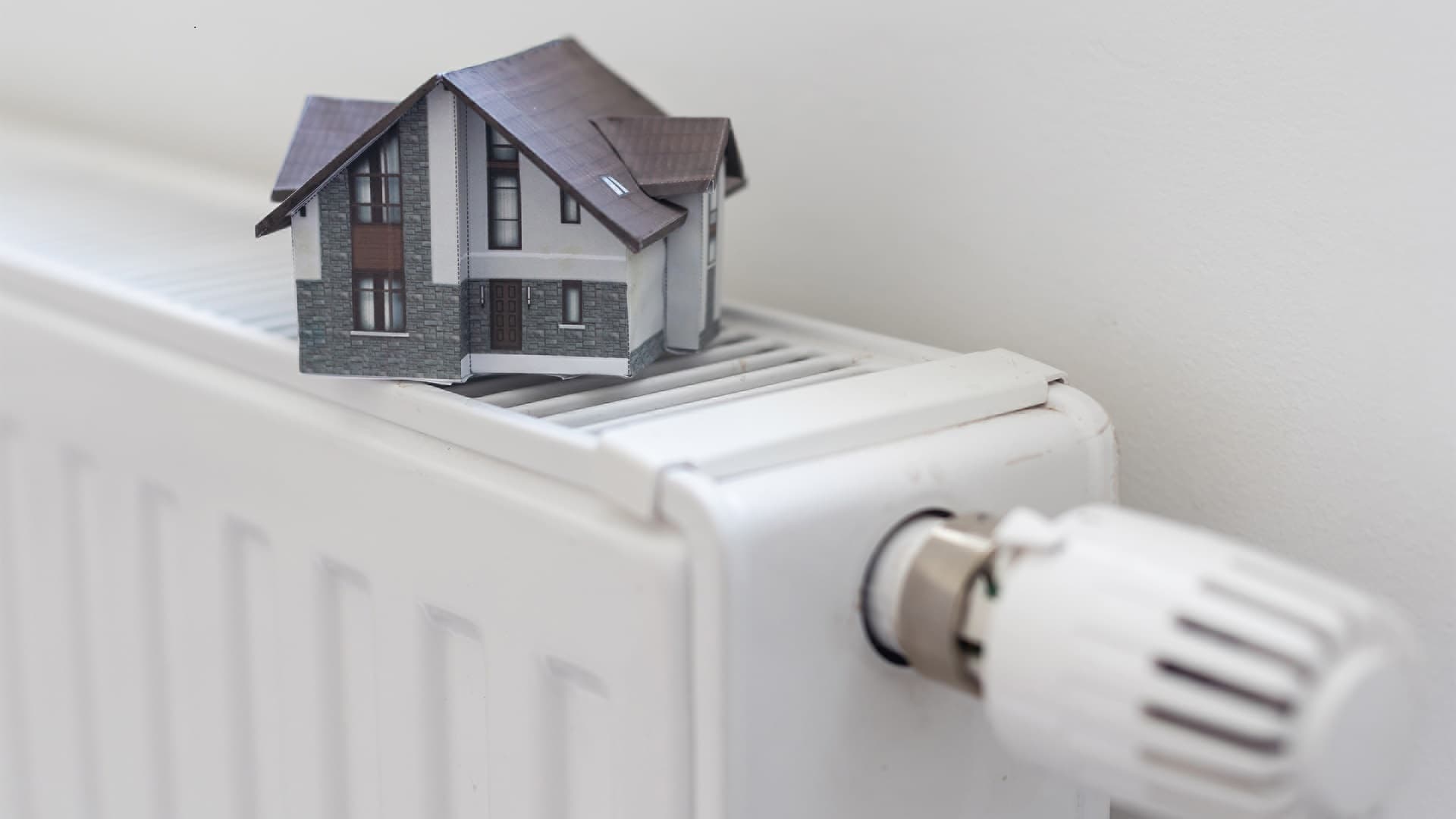 model-of-house-on-white-radiator-2025-01-10-02-24-23-utc