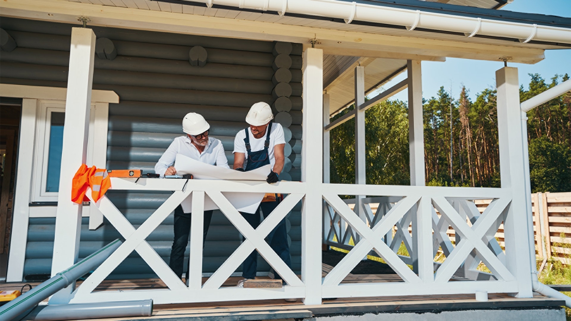two-male-workers-on-porch-inspecting-technical-doc-2025-03-10-07-58-22-utc.jpg